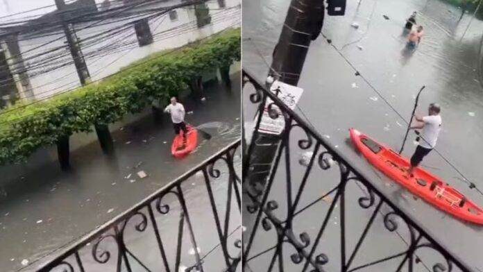 Homem pratica stand-up paddle em rua alagada de Fortaleza; veja vídeo
